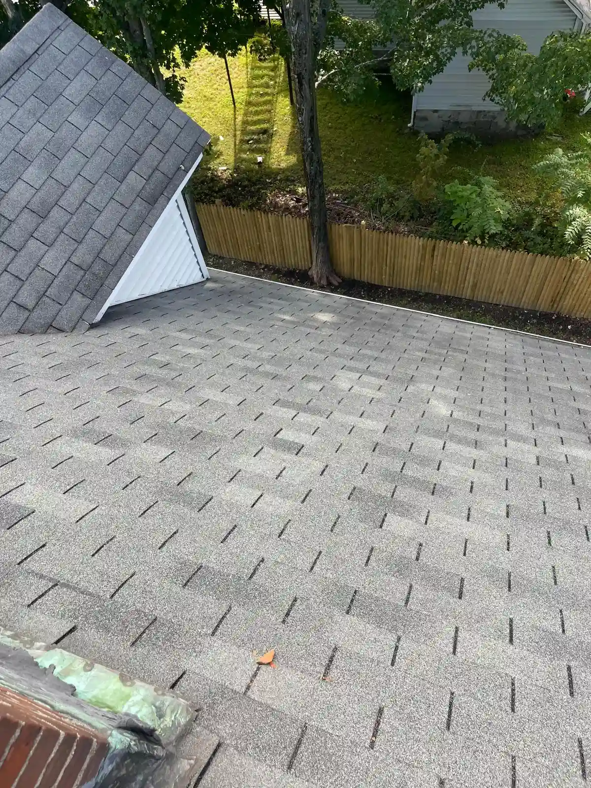 New asphalt shingle roof installed by JEF General Contracting